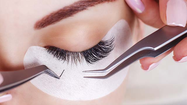 Eyelash extensions being attached