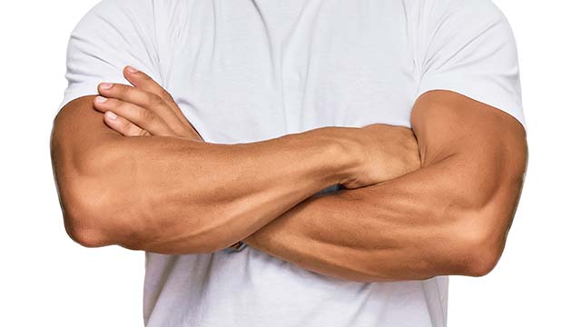 Male Waxing treatment showing man with waxed arms